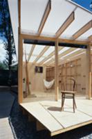 Old coffee house chair on wooden terrace and view 