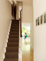 Traditional stairwell with view through open doorw