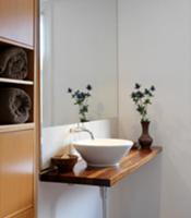 Minimalist washstand with white ceramic basin on w