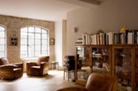 Comfortable living room with leather armchairs in 