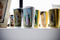 Collection of beakers with printed pictures of sai