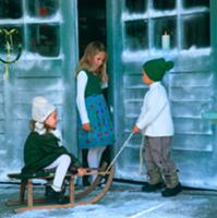 Three children with sledge in front of house