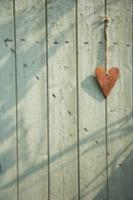 Heart hanging on a wooden door