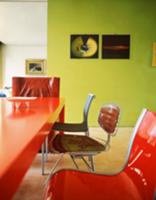 Red, plastic table with chairs in a variety of sty