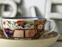 Porcelain teacup with gilt decoration (close-up)