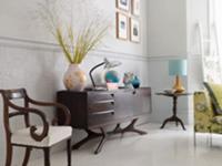 Sideboard and antique chair against wall with stuc