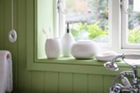 Bathroom utensils on windowsill