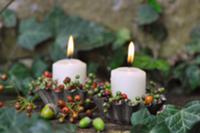 Candles in metal tart cases decorated with autumna