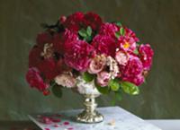 Bouquet of pink roses in silver bowl