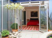 Small, contemporary courtyard terrace with view of