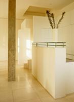 Foyer with stone pillar and modern counter in brig