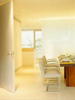 Light, modern dining room with festive table and c