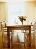 Rustic dining table in natural wood with a mixture