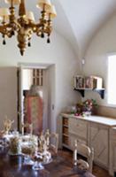 Mix of styles in dining room with chandelier and n