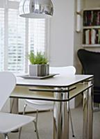 Small dining area in cool black and white with des