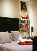 Stylish black and white room with red accessories 