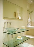 Modern, cream bathroom in classic setting with gla