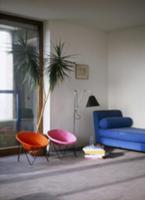 Colourful retro chairs and blue chaise longue in m