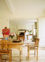 Rustic dining area with objets d'art on table and 