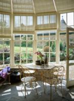 Delicate, white-painted metal table and chairs in 