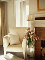 Elegant armchair with white cover and bouquet of l