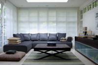 Grey corner sofa with matching cushions and coffee