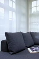 Grey sofa cushions to match sofa against transpare