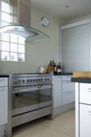 Designer kitchen with stainless steel cooker and e