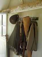 Coat rack in rustic hunting lodge