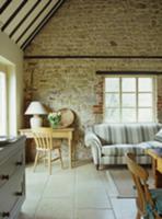 Corner of living room with rustic wooden table and