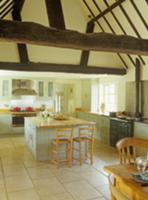 Kitchen island with bar stools in open-plan kitche