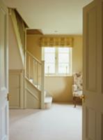 View through open double doors into bright stairwe