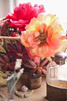 Overblown roses in basket and heart-shaped, brass 