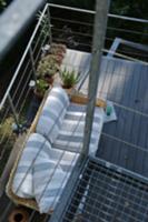 View down onto terrace with rustic sofa