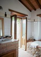 Brick-built washstand and bathtub in modernised ba