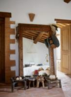 Various ethnic-style wooden footstools in front of