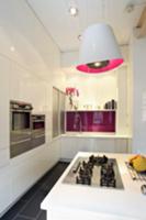 Kitchen with white cupboard doors and designer pen