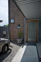 Roofed walkway and front door of contemporary hous