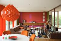 Red, retro pendant lamp above dining area and chil