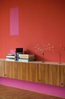 Wooden sideboard against wall in different shades 