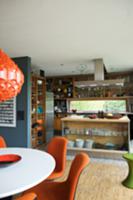 Chairs with orange upholstery in dining area in fr