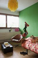 Corner of teenager's room with green-painted wall 