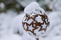 Ball made of rusty metal stars topped and filled w