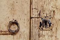 Weathered door with doorknocker