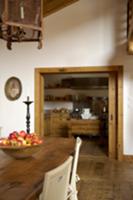 View through a sliding door into the kitchen; a di