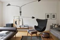 Living room in shades of grey with couch, armchair