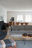 Open-plan living-dining room in elegant grey and w