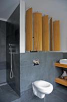 Rotatable wooden screen panels in modern bathroom 