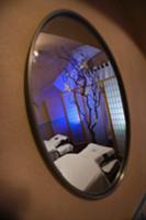 Spa room reflected in mirror on wall