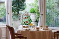 Table set with pastries and tea service